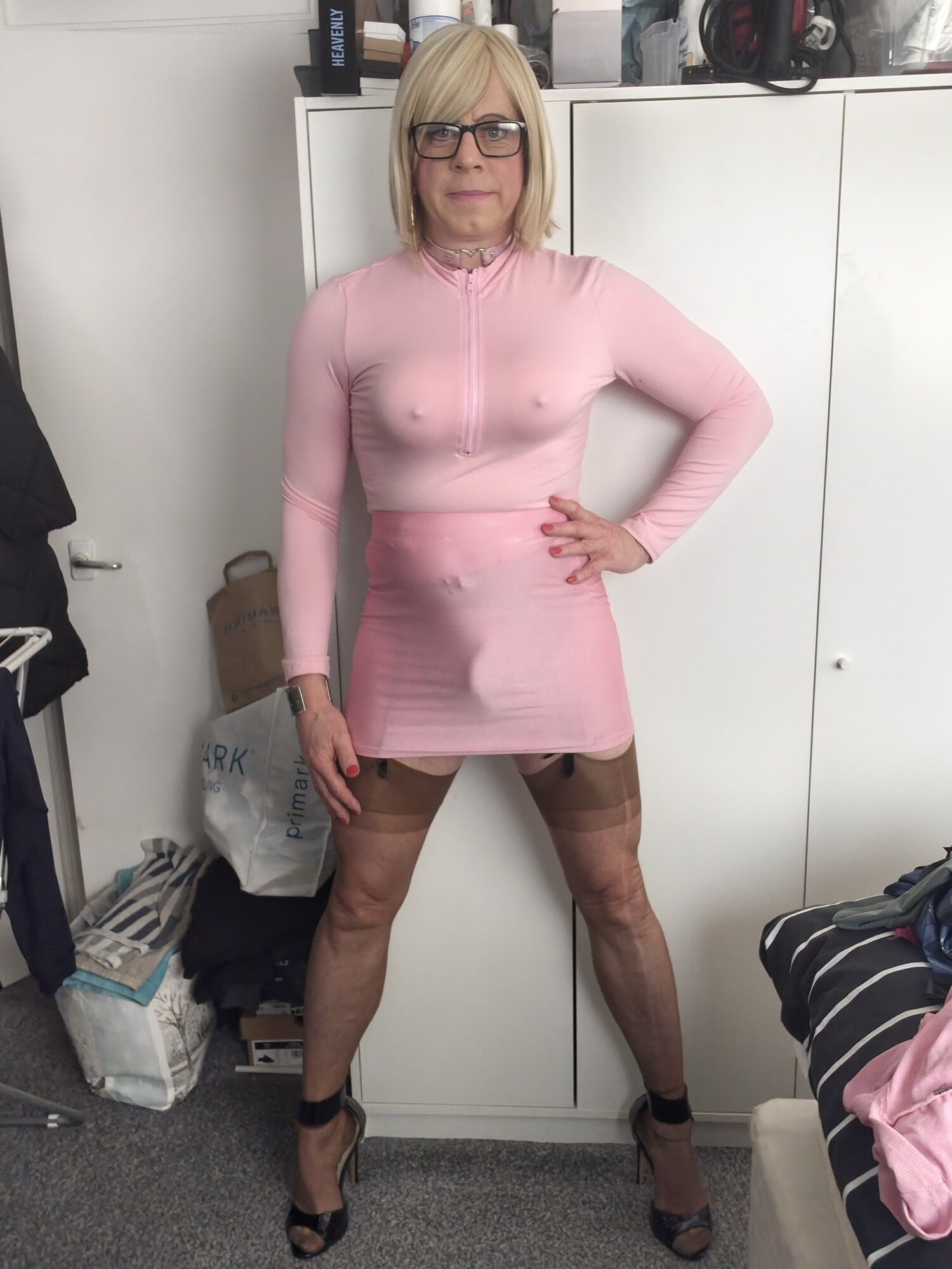 Crossdresser Holly pink mini skirt and stockings