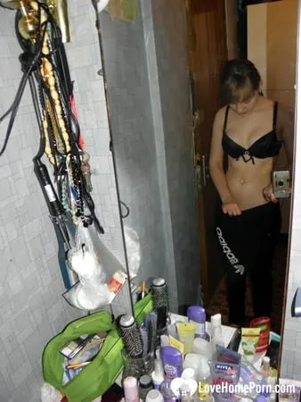 petite teen slowly strips off her clothes         