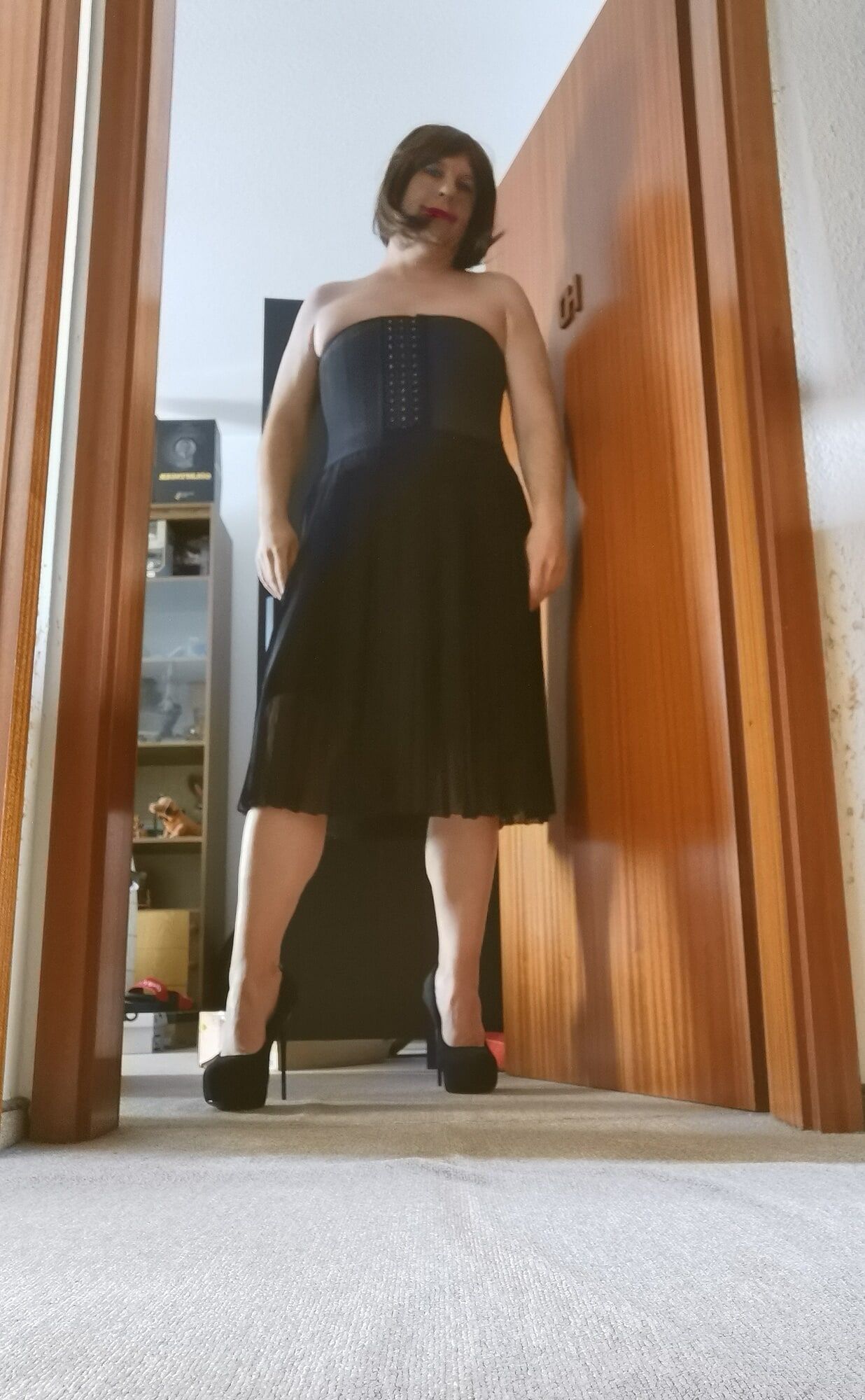 Posing Sexy Wearing Black Skirt, Platform Heels And Wig