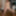 Alba strips off her lingerie by the dining table