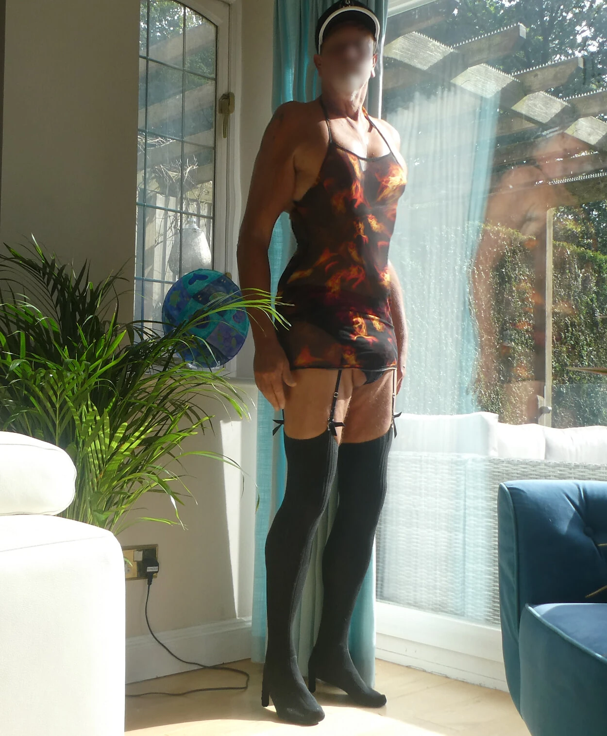 Mature Sissy poses in various outfits