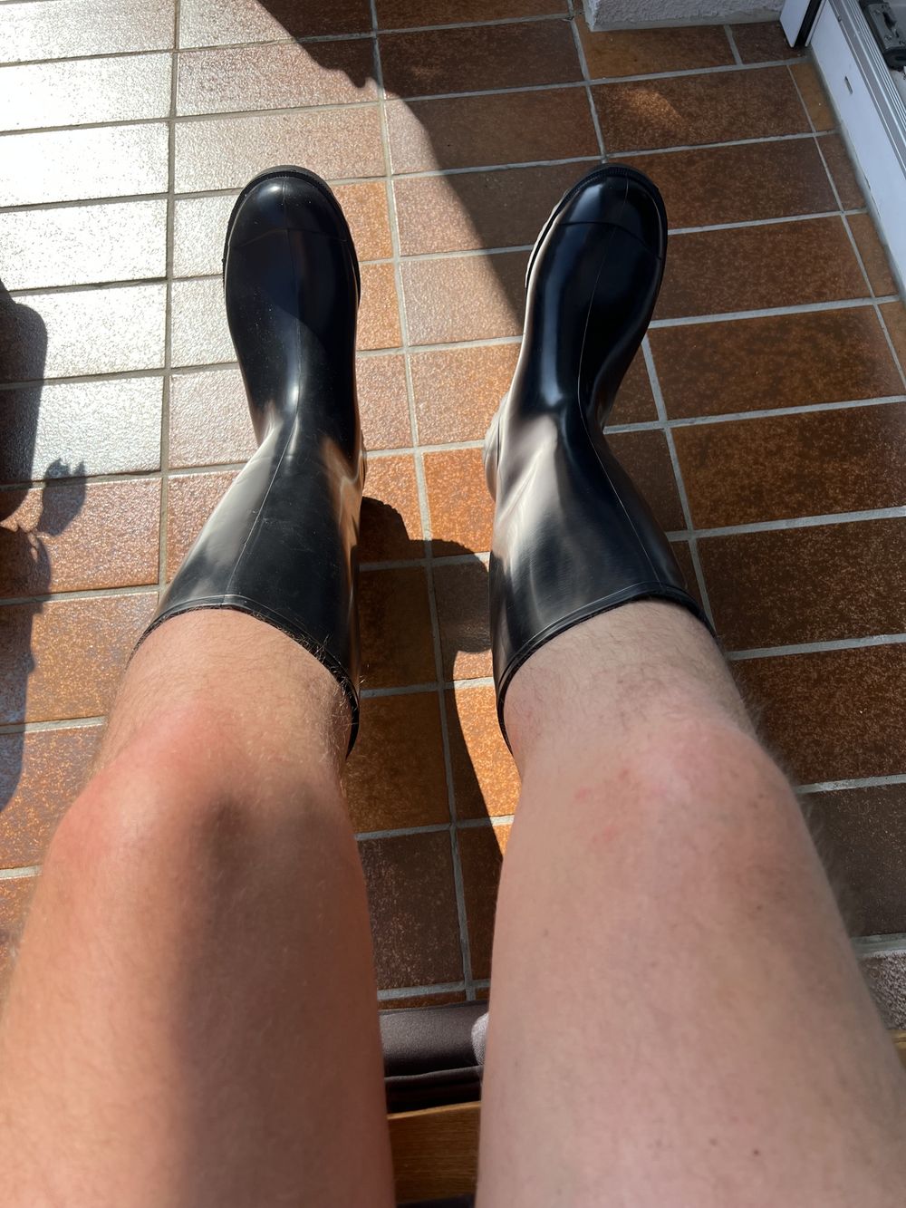 Sunbathing with rubberboots #2