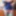 Sissy Aleksa posing in blue corset and green stockings