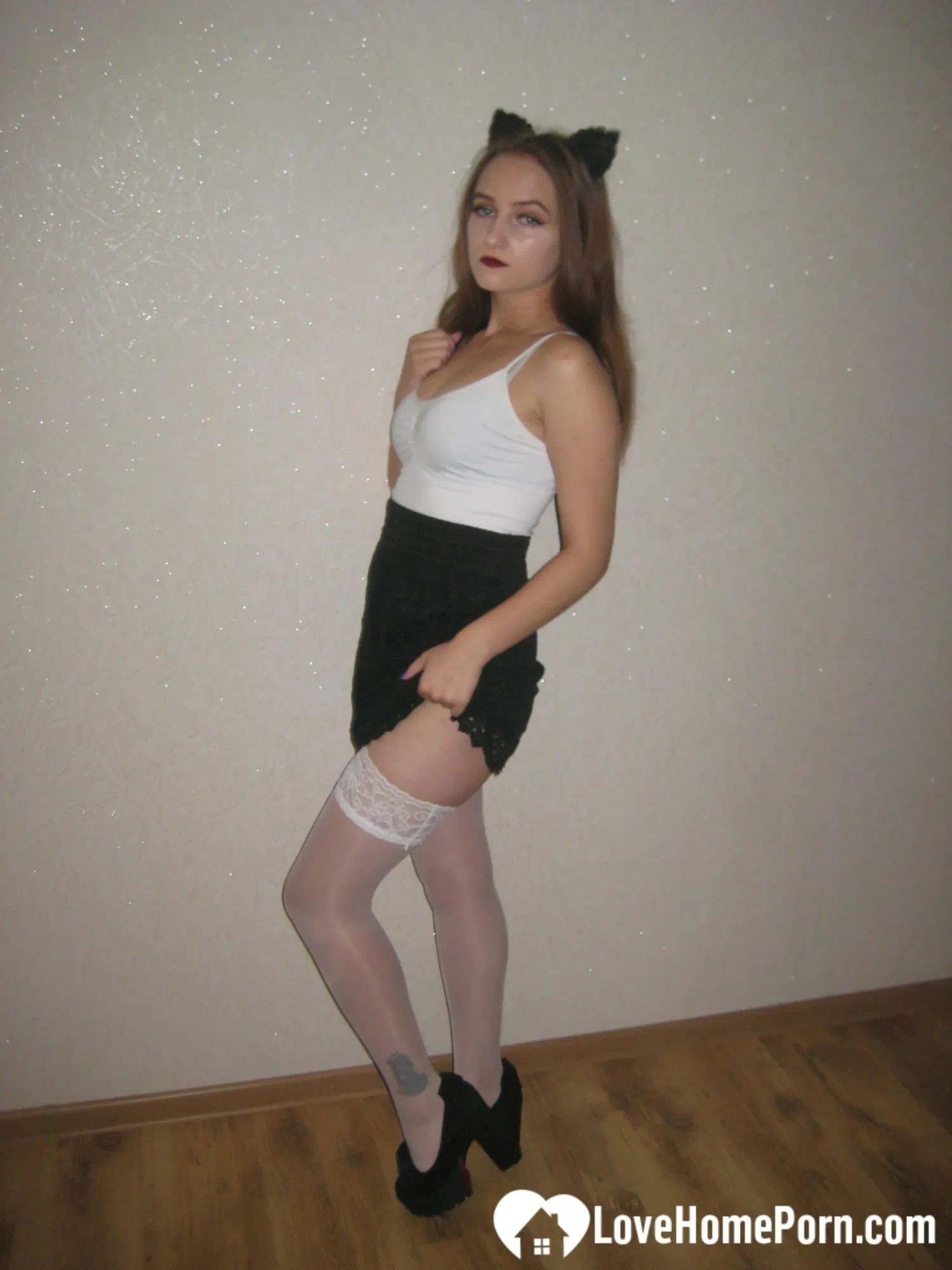 Kinky girlfriend in stockings displaying her amazing legs