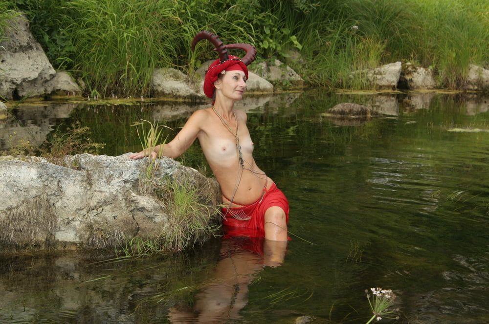 With Horns In Red Dress In Shallow River #16