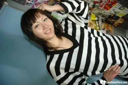 hot asian strips pantyhose and does sexy poses         