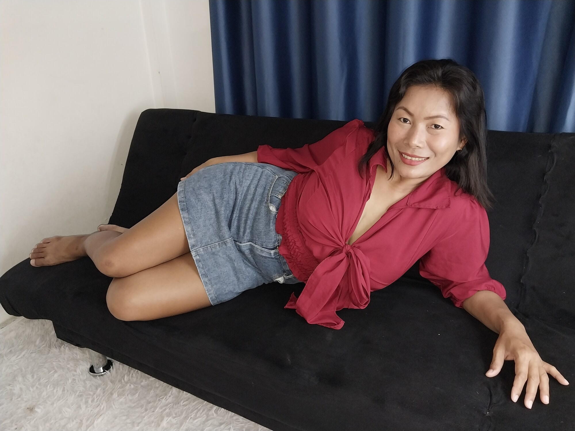 Thaiger on the Sofa in a Mini Skirt and a Red Top #5