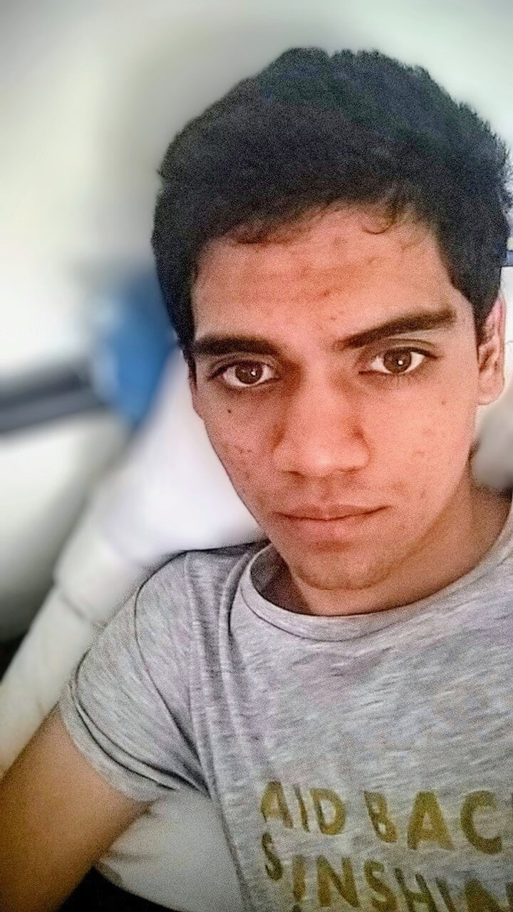 Very cute boy naked in his room