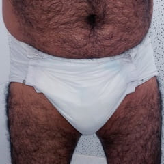 SHOWING WHITE DIAPER IN WORK BATHROOM.