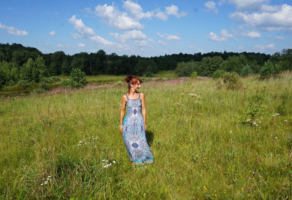 In blue dress in field #15