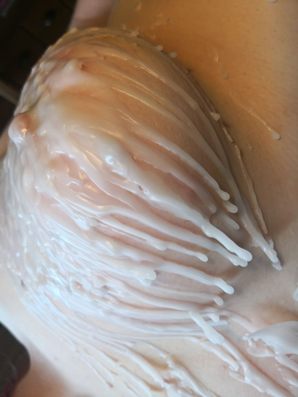 Breasts in hot wax