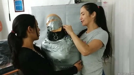 sexy girl trapped in ultra tight layered mummification         