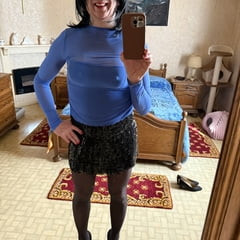 Evy's blue evening dress and black mini-skirt