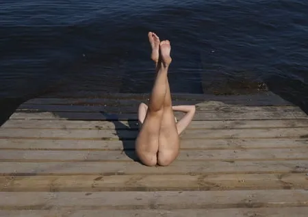 legs play on a wooden platform         