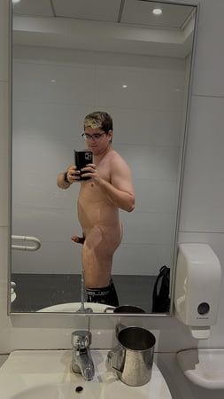 Naked in a mall public toilet