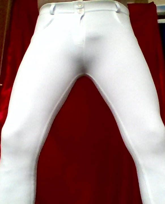 IN A WHITE TIGHT PANTS.