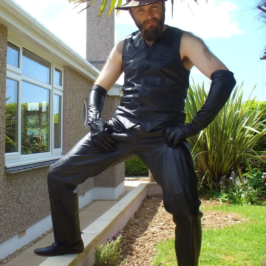 Leather Master outdoors posing in full leather