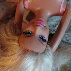 Barbie sunbathes after swimming in the ocean