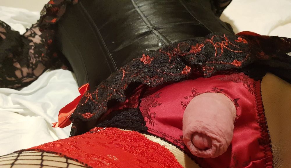 Crossdressing in black and red satin lingerie with fishnets #3