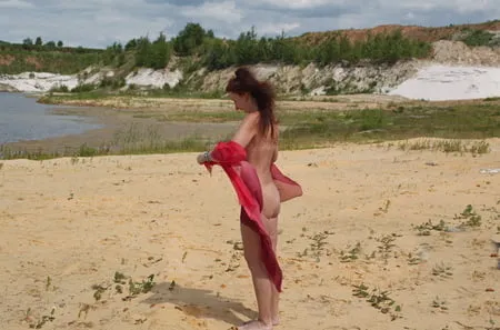 red shawl on white sand         