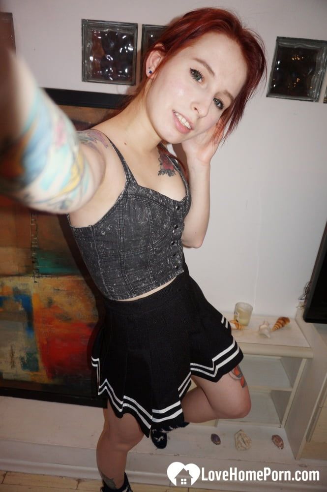 Desirable redhead painter showing off sexy outfits #6