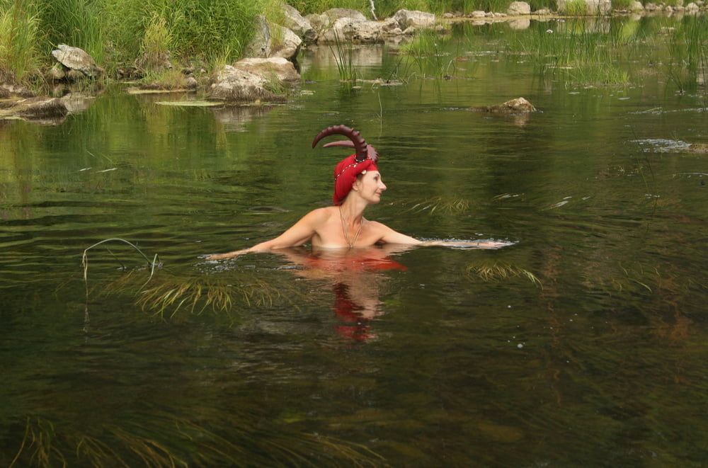 With Horns In Red Dress In Shallow River #44