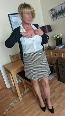 ready for work in skirt blouse pantyhose and heels         