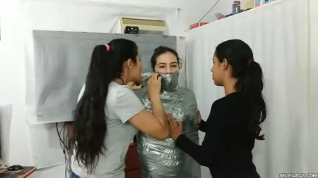 sexy girl trapped in ultra tight layered mummification         