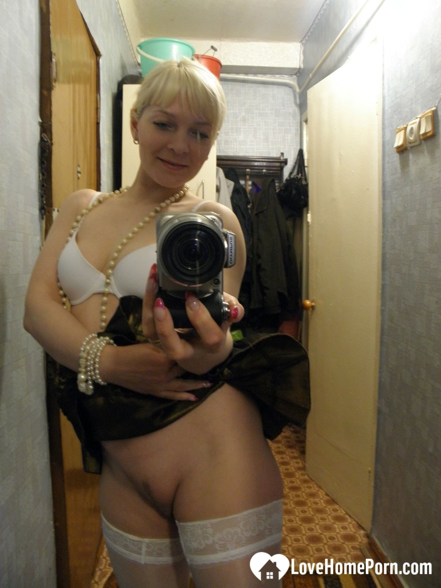 Aroused blonde in stockings taking naughty selfies #16