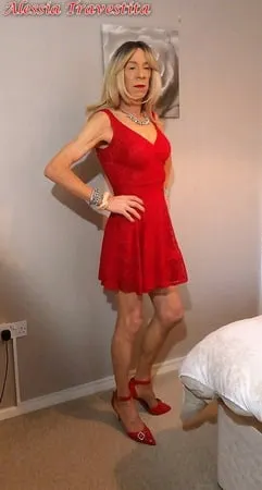    alessia travestita in flirty red dress         