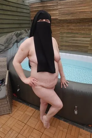 wife showing off big breasts and ass in niqab         