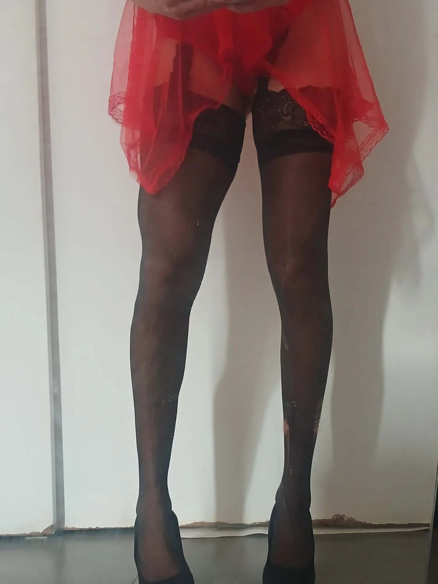 Red nightie black stoking high heels 