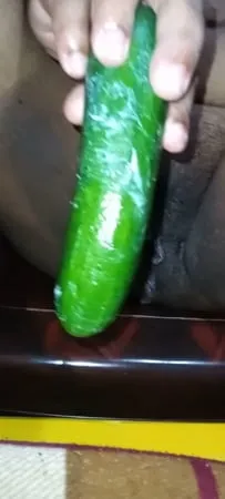 my wife getting fun with cucumber         