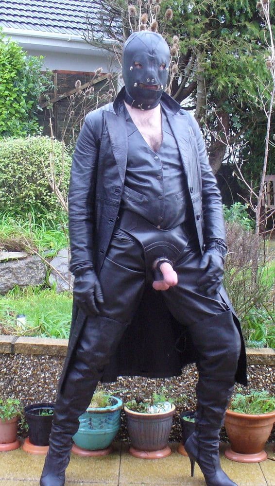 Leather Master in cock harness, boots and hood