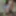 Young wife undresses and walks naked in the forest park