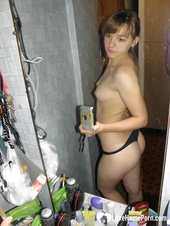 petite teen slowly strips off her clothes         