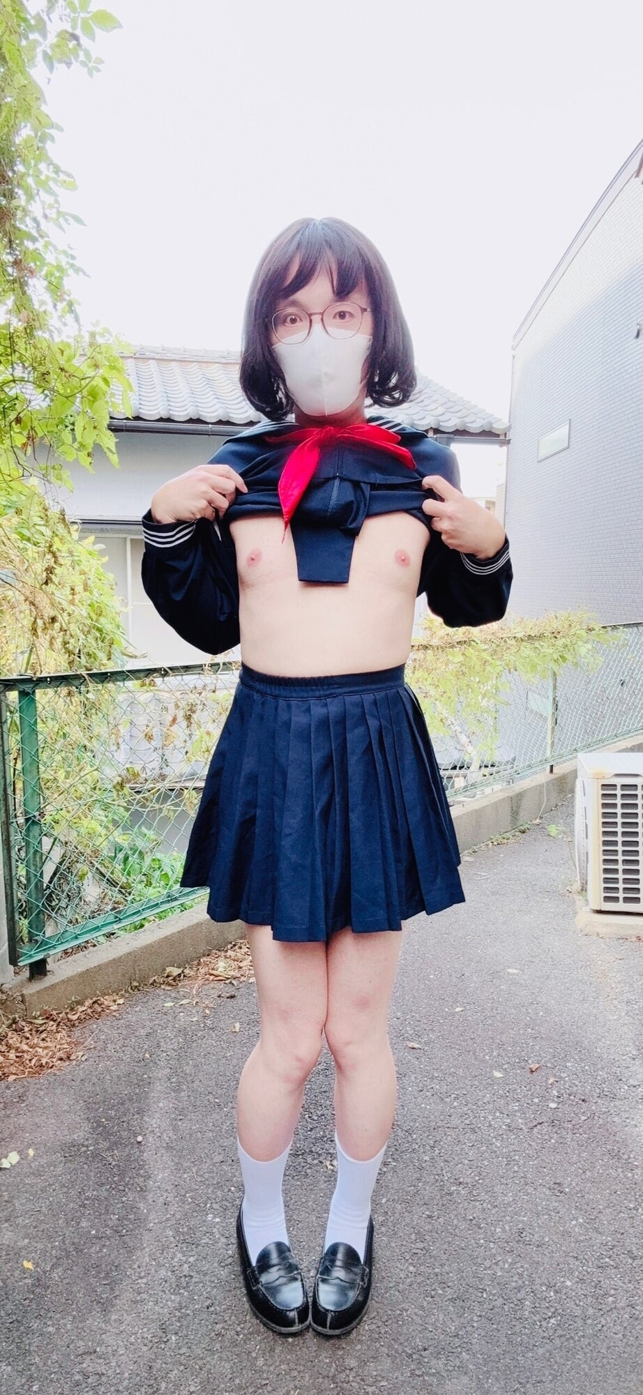A trans woman in a swimsuit under sailor uniform outside  #15