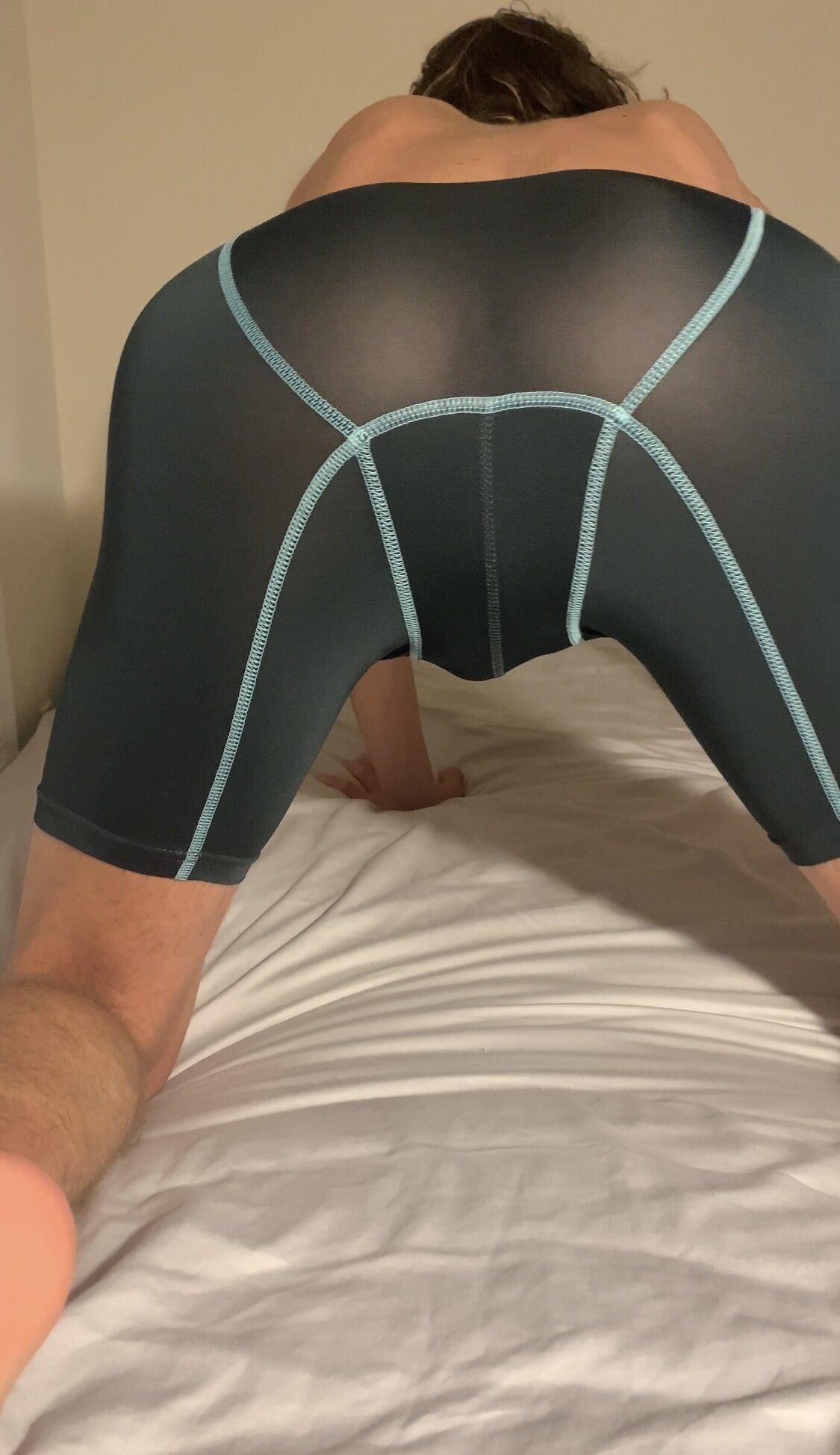 Sexy boy in spandex underwear strips