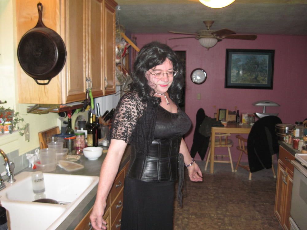 Trixie modeling a black lace top with a black leather corset #8