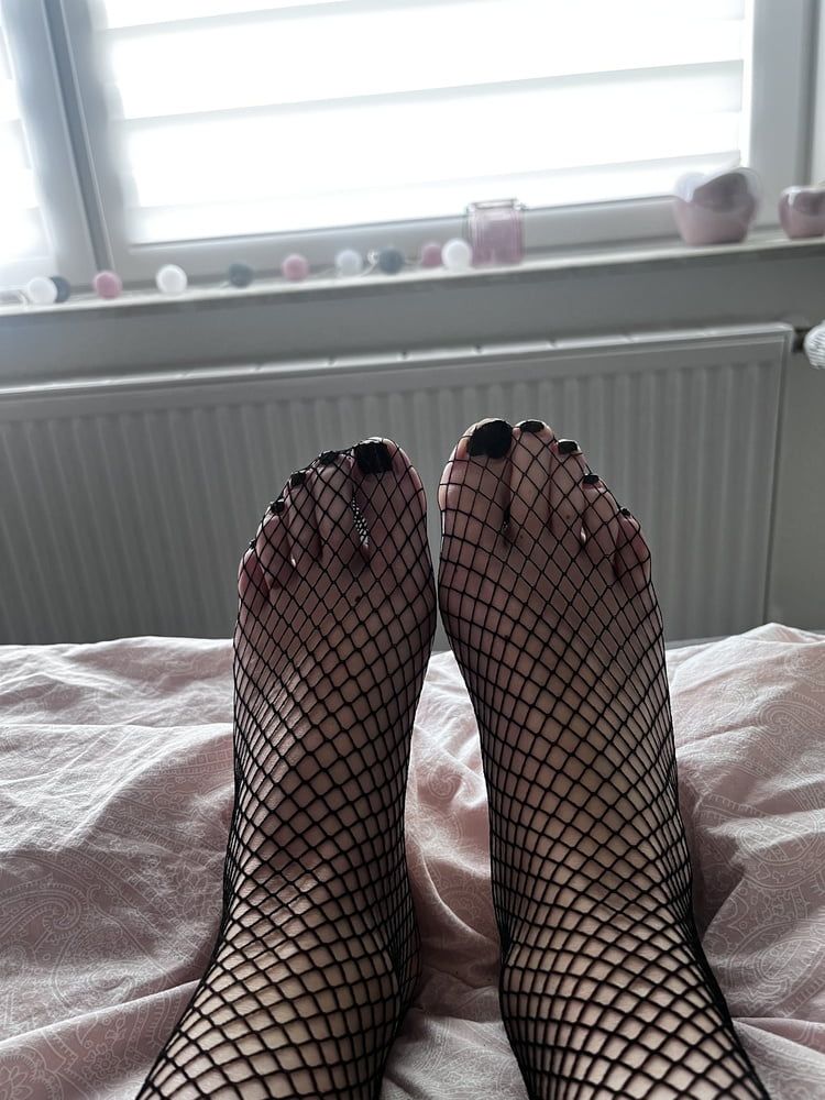 Foot with fishnet socks  #2