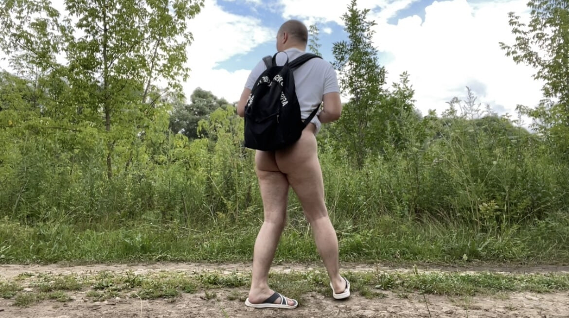 A photo of a naked walk in the summer forest #11
