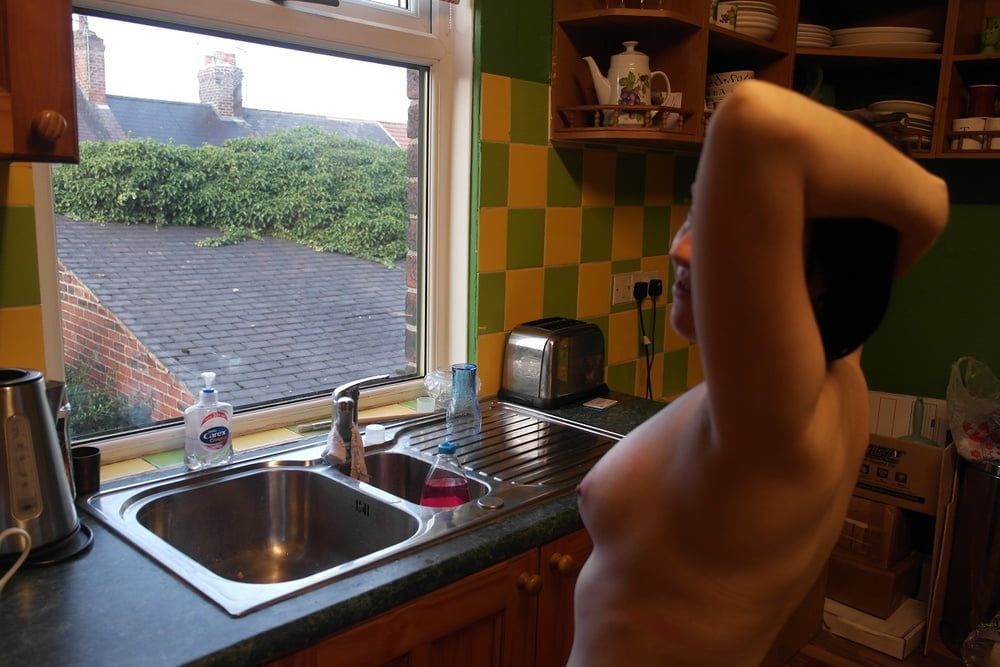 posing nude in window #26