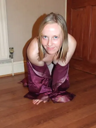 young wife posing in silk nighty         