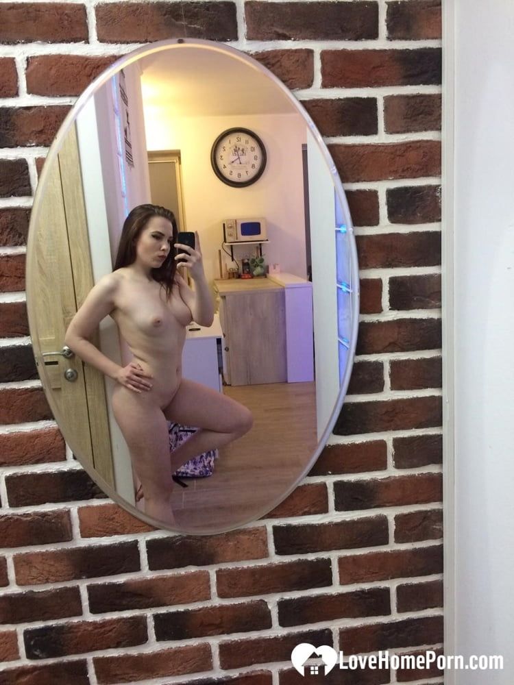 Devilish cutie posing nude for a mirror #5