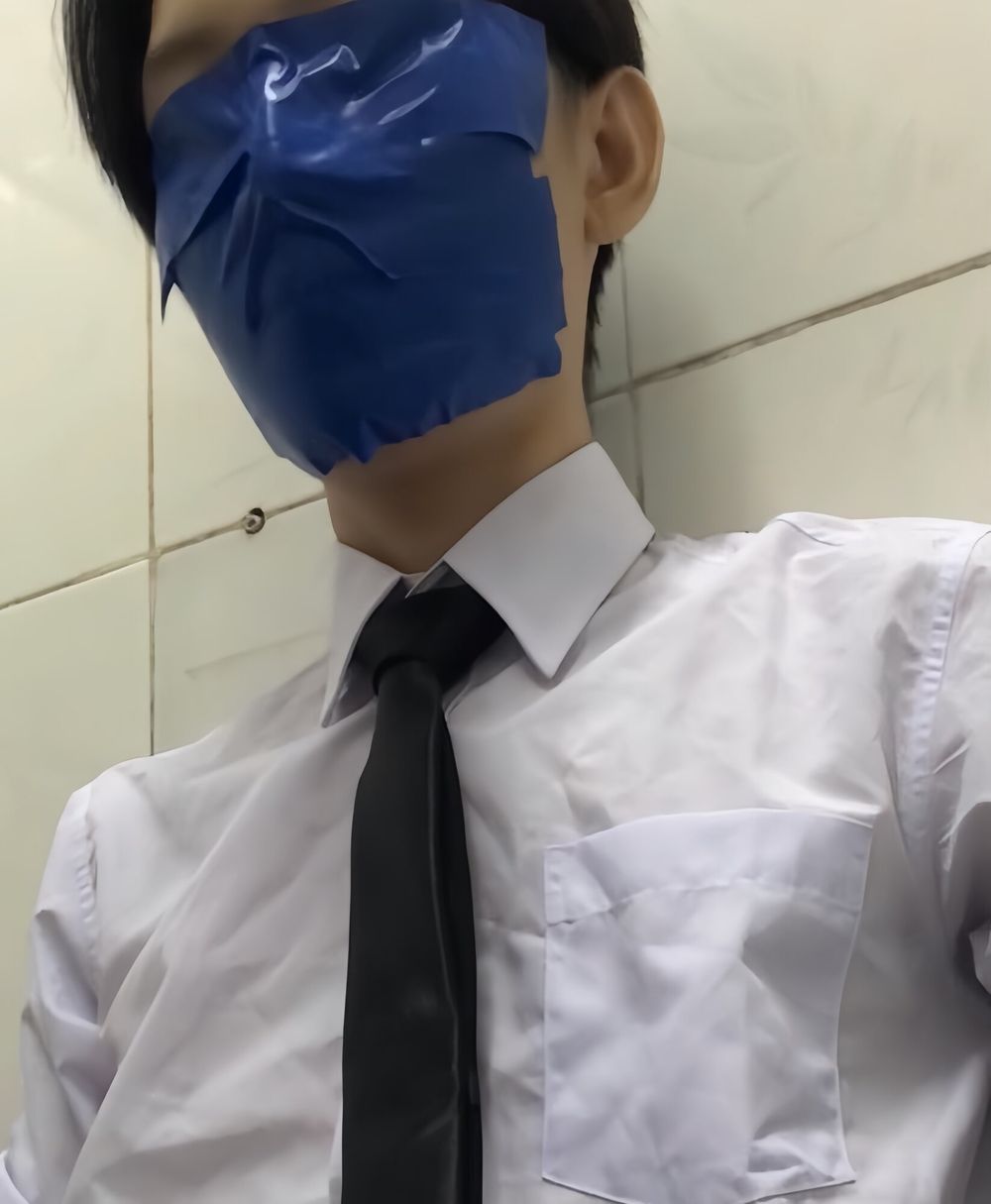 Wearing a white shirt and shiny black tie, gagged with duct  #5