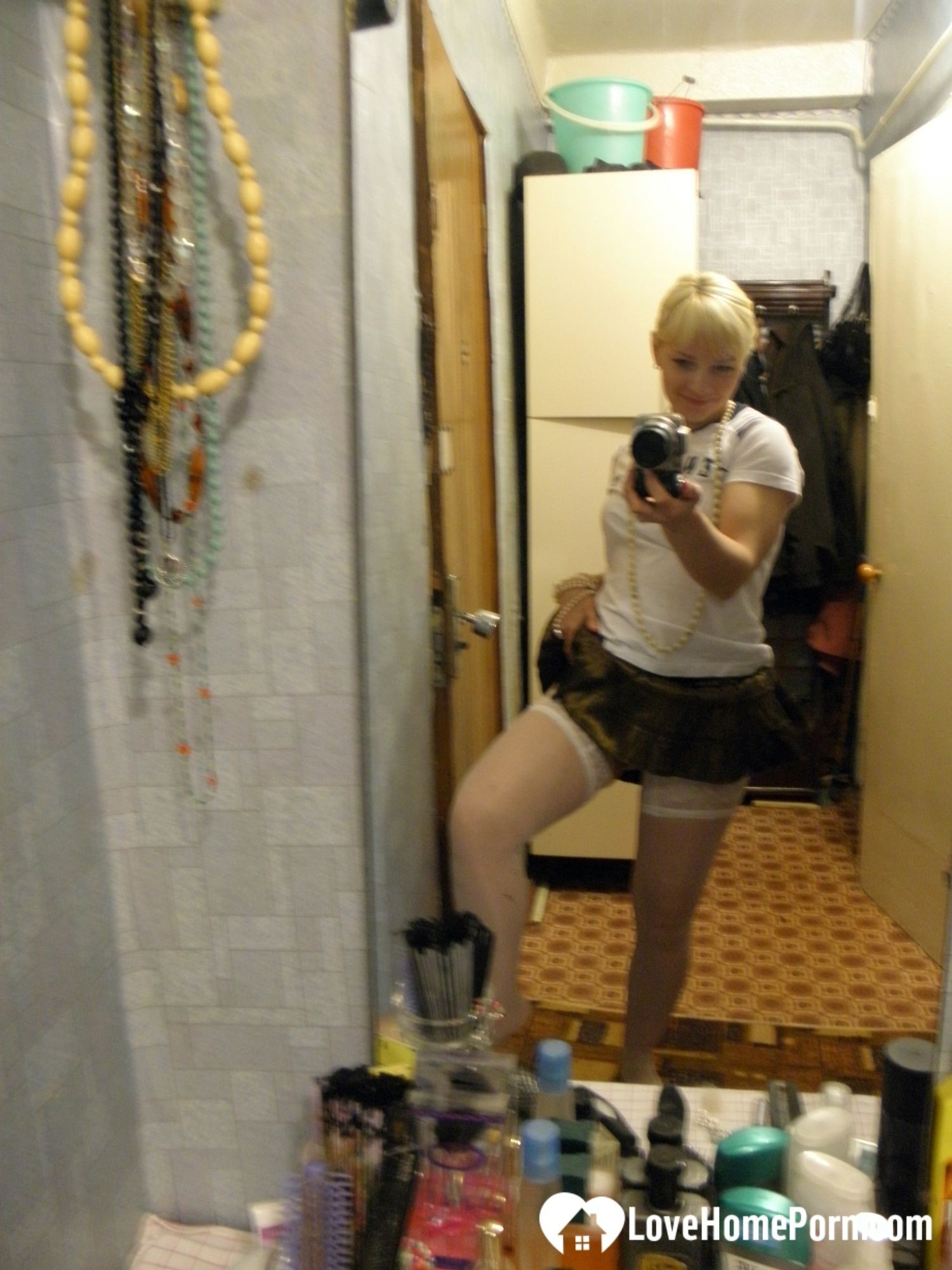 Aroused blonde in stockings taking naughty selfies #8
