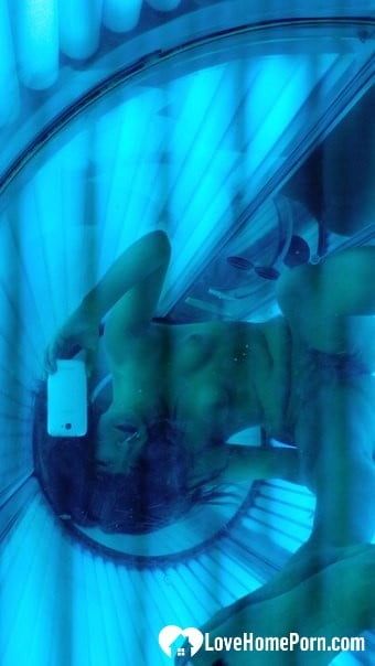 Asian sweetie taking selfies while tanning her body #10