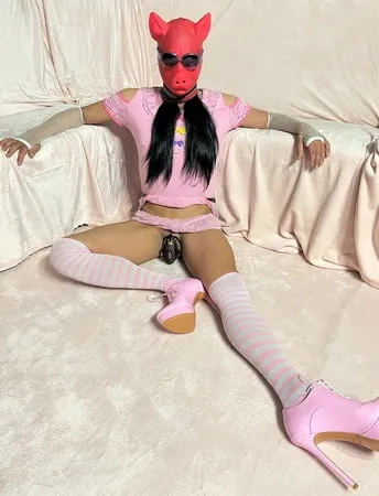 sissy wearing a pink dress heels and chastity cage pt           