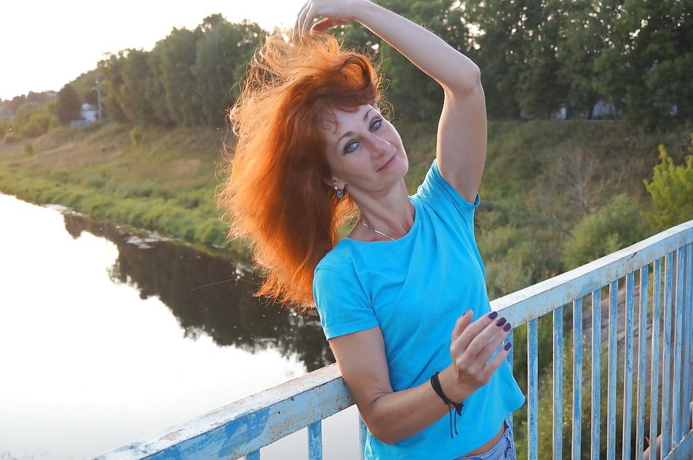 Flamehair in evening on the bridge