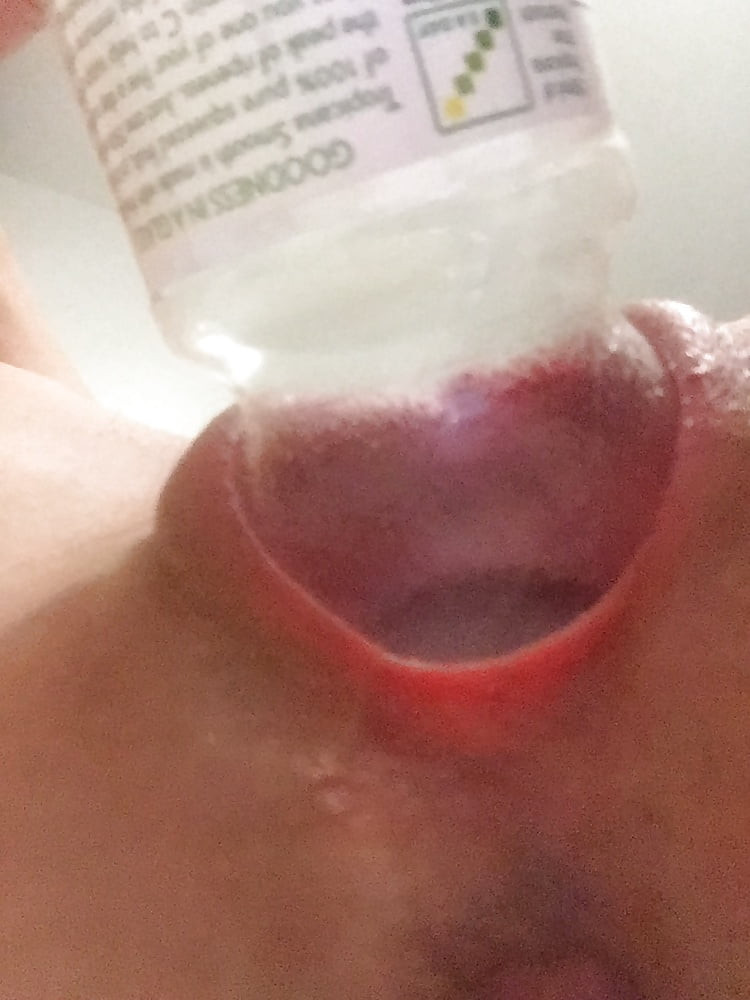 The neck of a Tropicana bottle swallowed